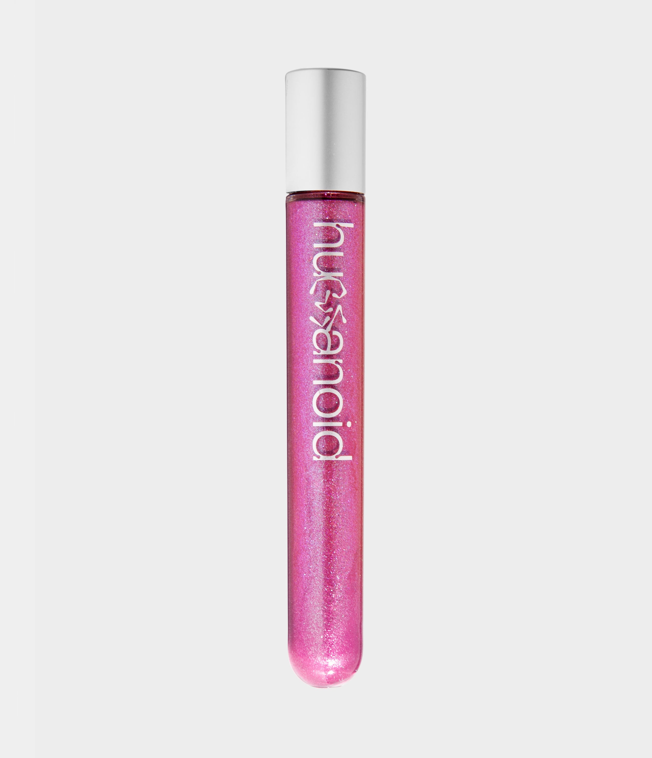 A transparent tube of shimmery pink body and face makeup with a white humanoid logo and silver cap