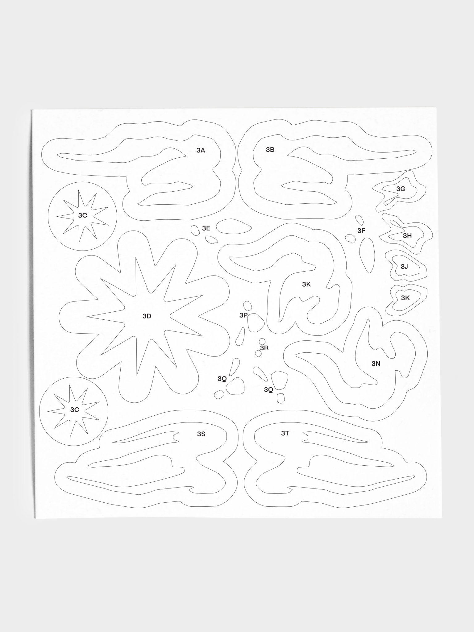 Closeup of stencil sheet with various star and geometric shapes